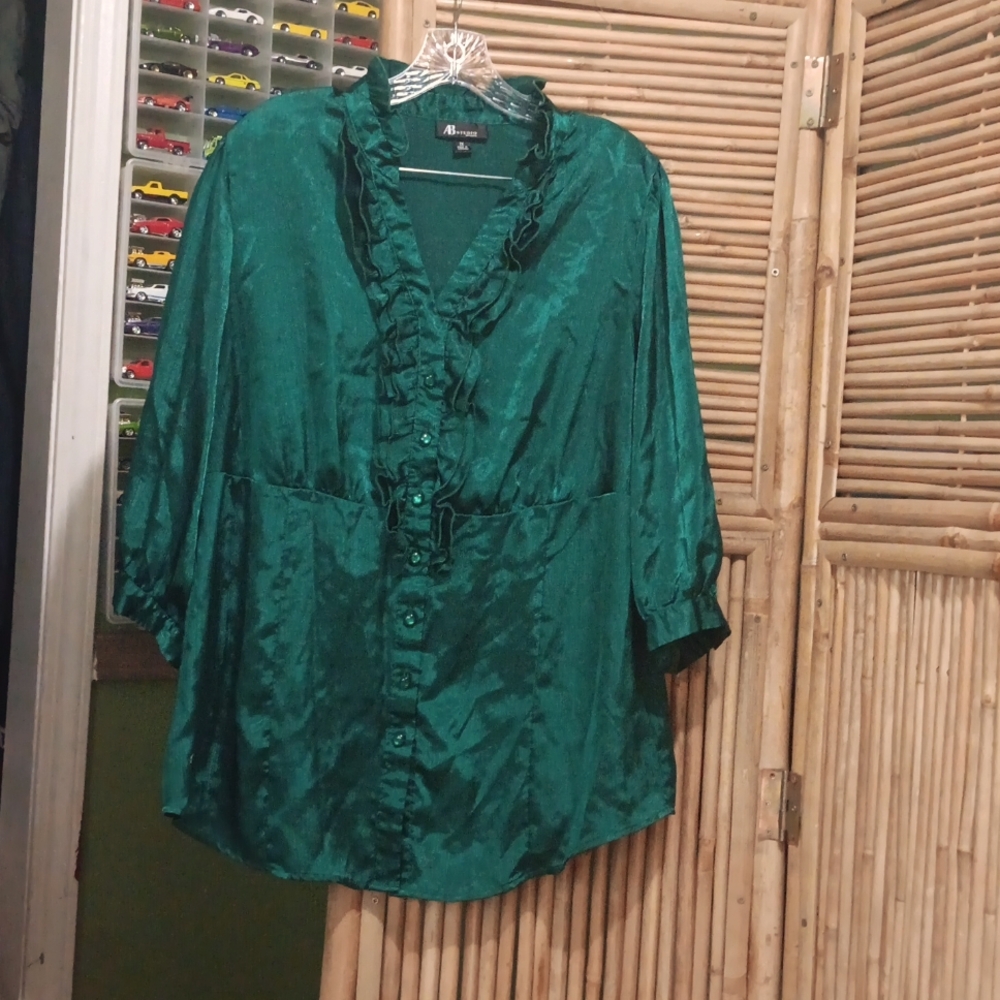 Very pretty green blouse with ruffles and buttons in the front